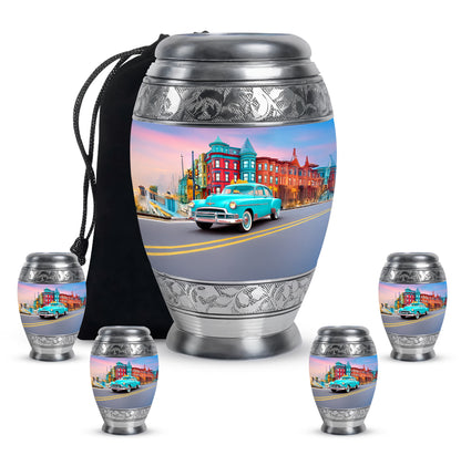 Slate Blue Car Cremation Urn detail view - ornate monarch-style car relief on brushed aluminum - memorial set with one large and four small urns