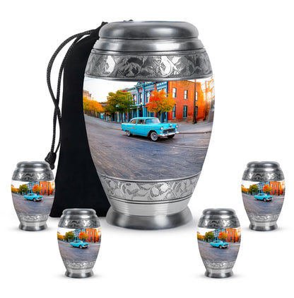 Antique Silver Car Cremation Urn detail view - majestic car pattern with filigree border - memorial set with one large and four small urns