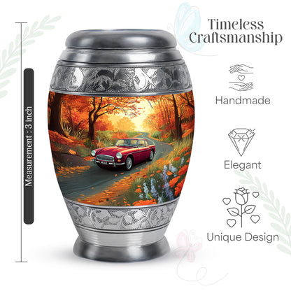 Amber Gold Car Cremation Urn lifestyle display on memorial shelf - ornate monarch-style car relief on brushed aluminum - mini keepsake memorial for portion of cremation ashes