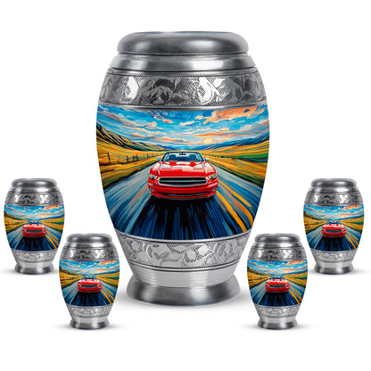Pastel Blue Car Cremation Urn detail view - ornate monarch-style car relief on brushed aluminum - memorial set with one large and four small urns