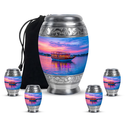 Powder Blue Boat Cremation Urn detail view - ornate monarch-style boat relief on brushed aluminum - memorial set with one large and four small urns