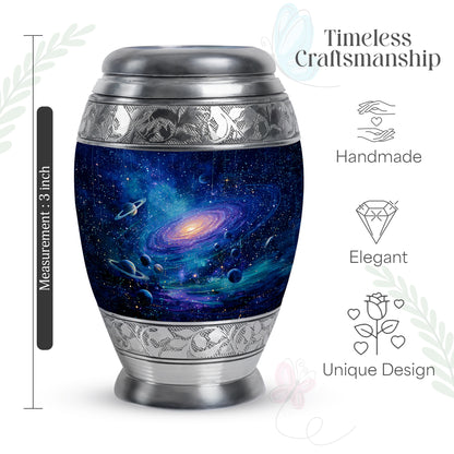 Sky Blue Galaxy Cremation Urn lifestyle display on memorial shelf - ornate monarch-style galaxy relief on brushed aluminum - mini keepsake memorial for portion of cremation ashes