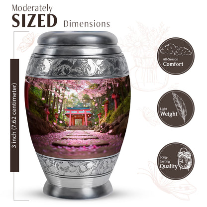Royal Gold Cherry Blossom Cremation Urn lifestyle display on memorial shelf - royal cherry blossom engraving with decorative scrollwork - mini keepsake memorial for portion of cremation ashes