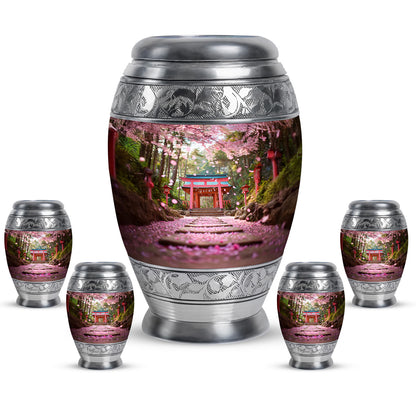 Sunrise Gold Cherry Blossom Cremation Urn detail view - ornate monarch-style cherry blossom relief on brushed aluminum - memorial set with one large and four small urns