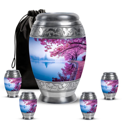 Powder Blue Cherry Blossom Cremation Urn detail view - ornate monarch-style cherry blossom relief on brushed aluminum - memorial set with one large and four small urns