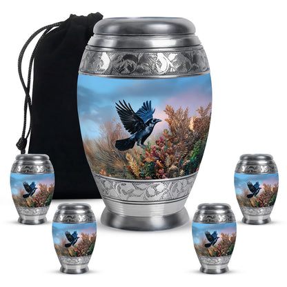 Sapphire Blue Crow Cremation Urn detail view - majestic crow pattern with filigree border - memorial set with one large and four small urns