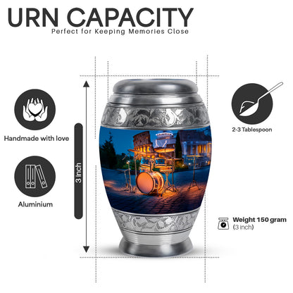Indigo Drums Cremation Urn lifestyle display on memorial shelf - ornate monarch-style drums relief on brushed aluminum - mini keepsake memorial for portion of cremation ashes