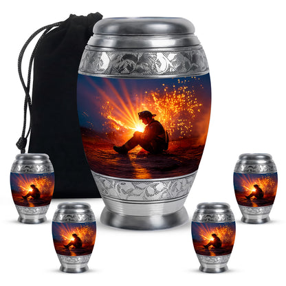 Indigo Firefighter Cremation Urn detail view - ornate monarch-style firefighter relief on brushed aluminum - memorial set with one large and four small urns