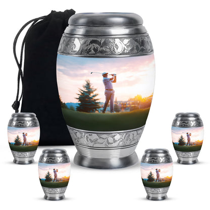 Chrome Silver Golf Cremation Urn detail view - majestic golf pattern with filigree border - memorial set with one large and four small urns
