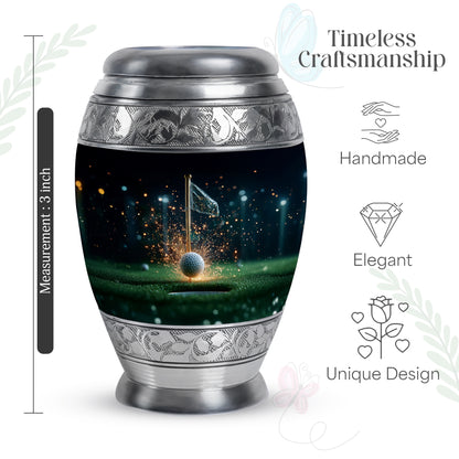 Jet Black Golf Cremation Urn lifestyle display on memorial shelf - ornate monarch-style golf relief on brushed aluminum - mini keepsake memorial for portion of cremation ashes