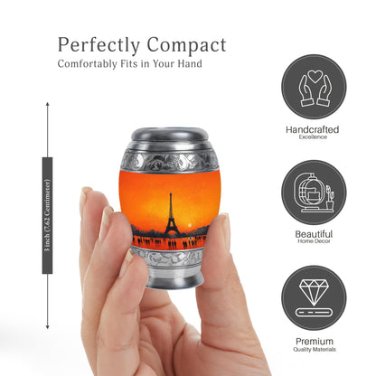 Amber Gold Eiffel Tower Cremation Urn lifestyle display on memorial shelf - ornate monarch-style eiffel tower relief on brushed aluminum - mini keepsake memorial for portion of cremation ashes
