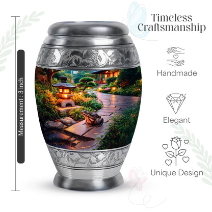 Golden Yellow Frog Cremation Urn lifestyle display on memorial shelf - ornate monarch-style frog relief on brushed aluminum - mini keepsake memorial for portion of cremation ashes