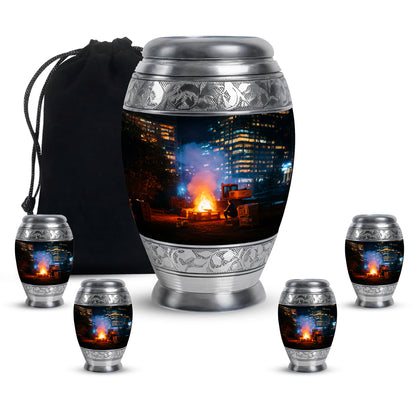 Glossy Black Campfire Cremation Urn detail view - ornate monarch-style campfire relief on brushed aluminum - memorial set with one large and four small urns