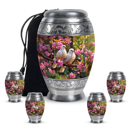 Glossy Black Dove Cremation Urn detail view - regal dove design with crown-inspired accents - memorial set with one large and four small urns