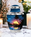 Decorative and vibrant blue Cremation Urn with a Sun motif, ideal for funerals and burials
