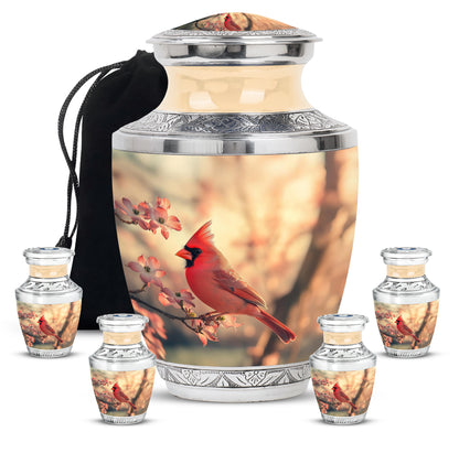 Burnished Gold Cardinal Cremation Urn lifestyle display on memorial shelf - stylized abstract cardinal pattern with bold lines - memorial set with one large and four small urns