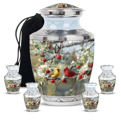 Gleaming Silver Cardinal Cremation Urn lifestyle display on memorial shelf - modern art-inspired cardinal motif on sleek aluminum - memorial set with one large and four small urns