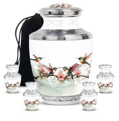 Moonlight Silver Hummingbird Cremation Urn lifestyle display on memorial shelf - artistic hummingbird interpretation with creative detail - memorial set with one large and four small urns