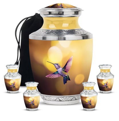 Antique Gold Hummingbird Cremation Urn lifestyle display on memorial shelf - modern art-inspired hummingbird motif on sleek aluminum - memorial set with one large and four small urns
