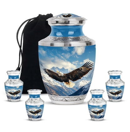 Soft Blue Eagle Cremation Urn lifestyle display on memorial shelf - stylized abstract eagle pattern with bold lines - memorial set with one large and four small urns