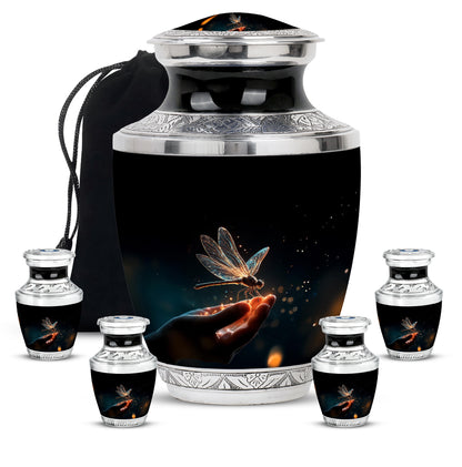 Midnight Black Dragonfly Cremation Urn lifestyle display on memorial shelf - stylized abstract dragonfly pattern with bold lines - memorial set with one large and four small urns