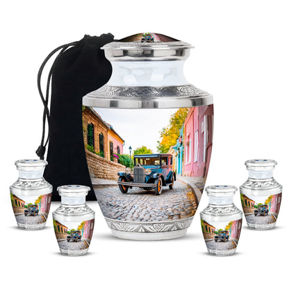 Pearl White Car Cremation Urn lifestyle display on memorial shelf - stylized abstract car pattern with bold lines - memorial set with one large and four small urns