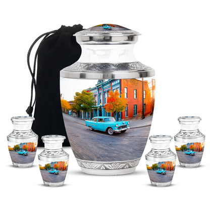 Antique Silver Car Cremation Urn lifestyle display on memorial shelf - artistic car interpretation with creative detail - memorial set with one large and four small urns