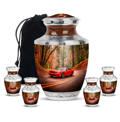 Warm Gold Car Cremation Urn lifestyle display on memorial shelf - stylized abstract car pattern with bold lines - memorial set with one large and four small urns
