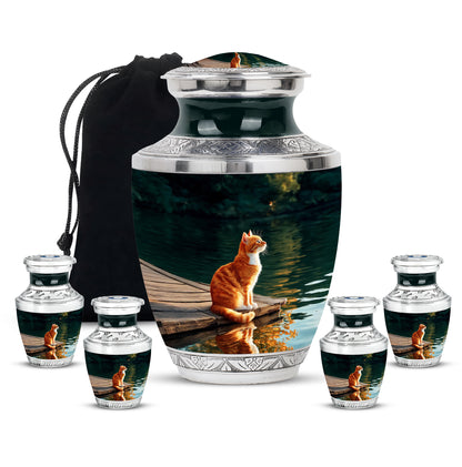 Charcoal Black Cat Cremation Urn lifestyle display on memorial shelf - stylized abstract cat pattern with bold lines - memorial set with one large and four small urns