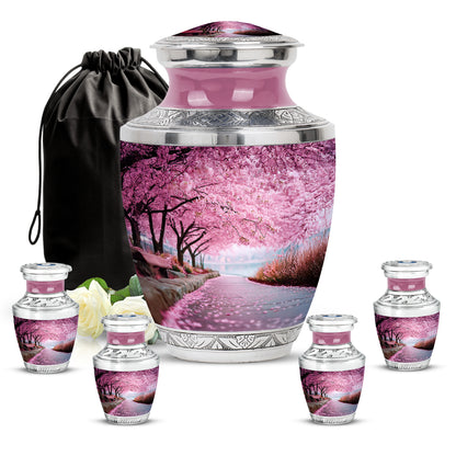 Coral Pink Cherry Blossom Cremation Urn lifestyle display on memorial shelf - modern art-inspired cherry blossom motif on sleek aluminum - memorial set with one large and four small urns