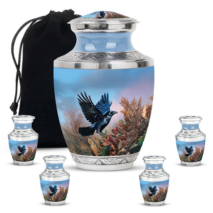 Celestial Blue Crow Cremation Urn lifestyle display on memorial shelf - modern art-inspired crow motif on sleek aluminum - memorial set with one large and four small urns