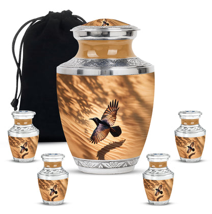 Burnished Gold Crow Cremation Urn lifestyle display on memorial shelf - artistic crow interpretation with creative detail - memorial set with one large and four small urns