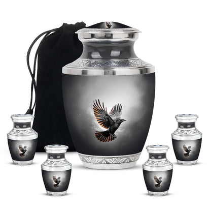 Dark Black Crow Cremation Urn lifestyle display on memorial shelf - stylized abstract crow pattern with bold lines - memorial set with one large and four small urns