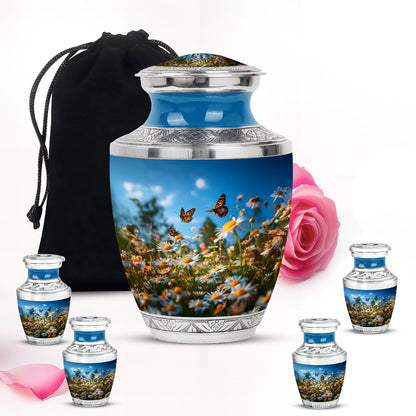 Serene Blue Daisy Cremation Urn lifestyle display on memorial shelf - artistic daisy interpretation with creative detail - memorial set with one large and four small urns