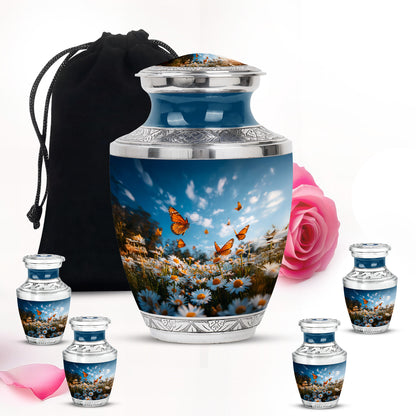 Sapphire Blue Daisy Cremation Urn lifestyle display on memorial shelf - stylized abstract daisy pattern with bold lines - memorial set with one large and four small urns