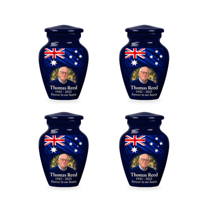 Four matching navy blue ringless keepsake urns with Australian flag artwork and fictional sample personalization.