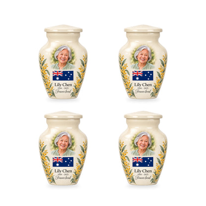 Four matching ivory ringless keepsake urns with Australian flag artwork and fictional sample personalization.