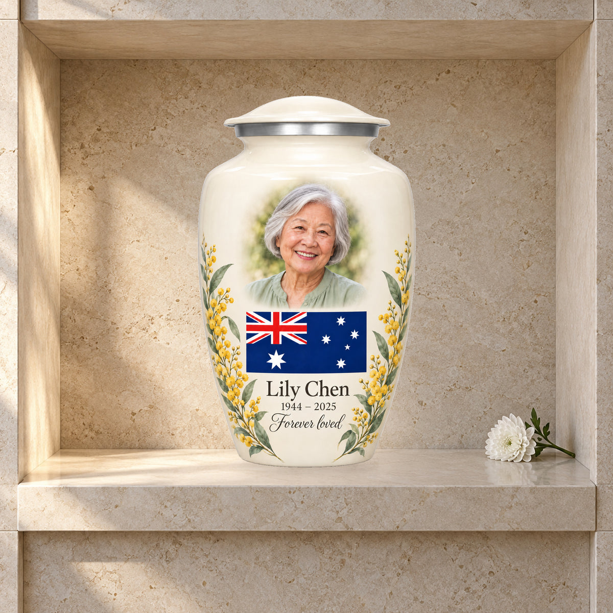 Ivory adult Ivory Wattle Remembrance Australian flag urn in a columbarium display; decorative props are not included.