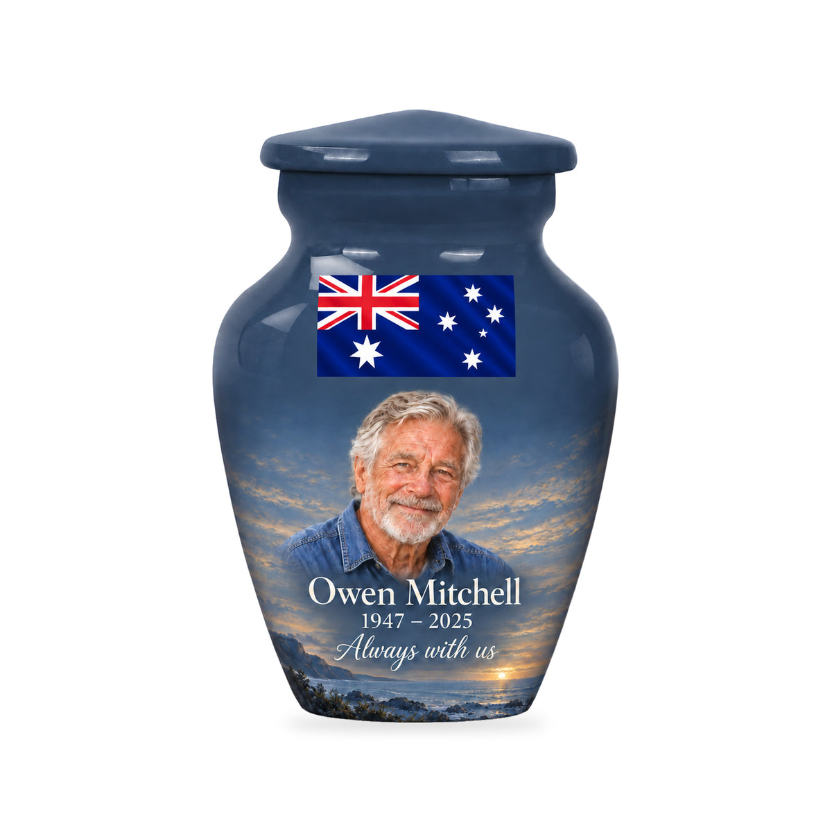 One slate blue ringless 3-inch keepsake urn with a wide Australian flag panel, a fictional portrait below and subtle coastal details on white.
