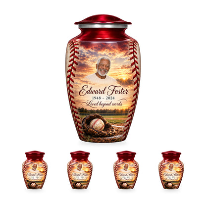 One Crimson Stitch adult baseball urn with four matching ringless keepsakes, showing 10-inch and 3-inch sizes together.