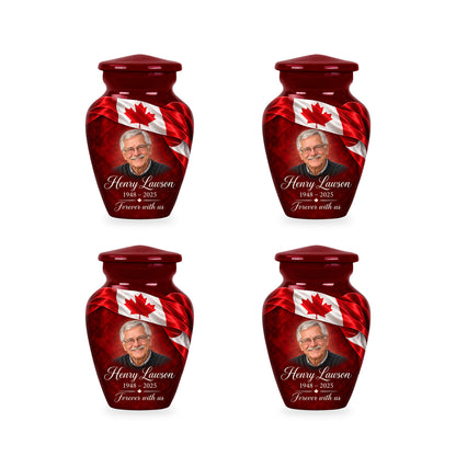 Four matching red Canadian flag keepsake urns with sample photo and inscription.