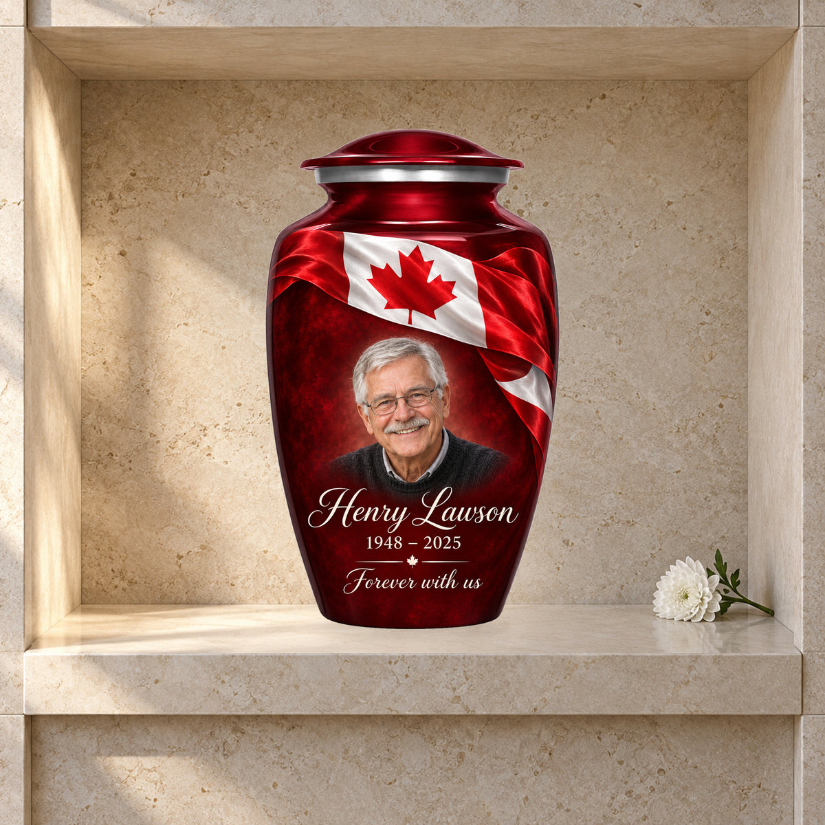 Red adult urn with Crimson Ribbon Remembrance Canadian flag artwork displayed in a columbarium niche.