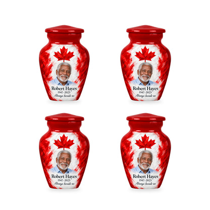 Four matching red Canadian flag keepsake urns with sample photo and inscription.