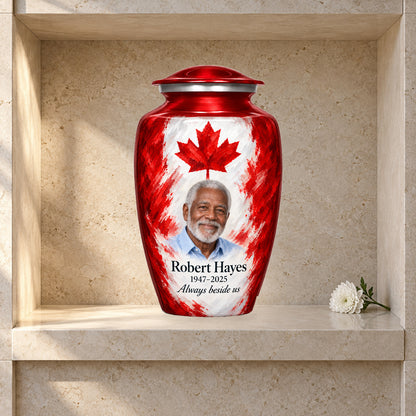 Red adult urn with Painterly Canadian Tribute Canadian flag artwork displayed in a columbarium niche.