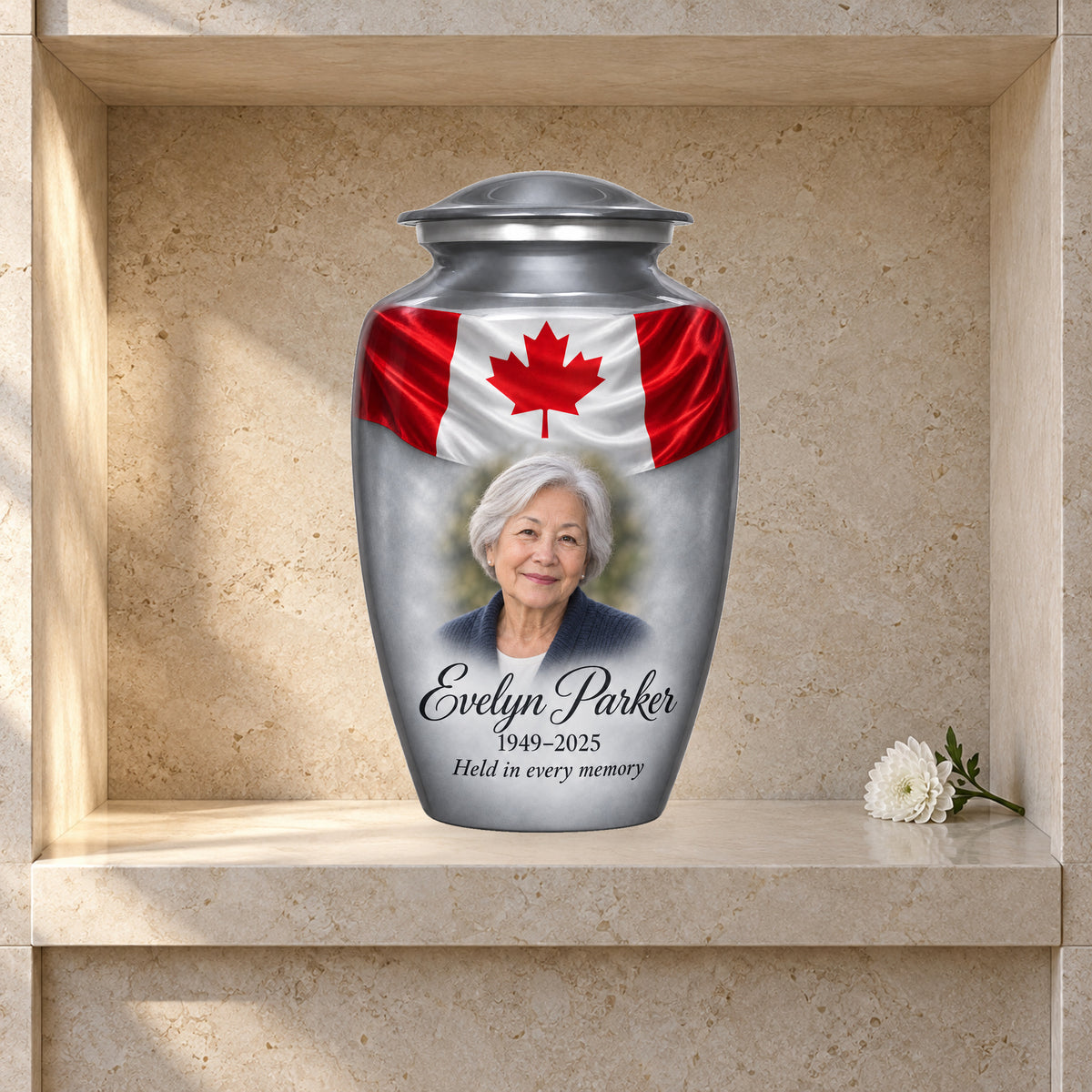 Gray adult urn with Silver Flag Remembrance Canadian flag artwork displayed in a columbarium niche.