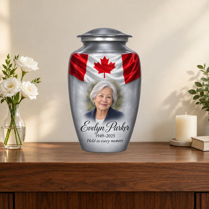Gray personalized Canadian flag adult urn on a memorial console.