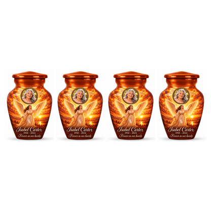 Four matching orange angel keepsake urns with sample photo personalization on a white background.