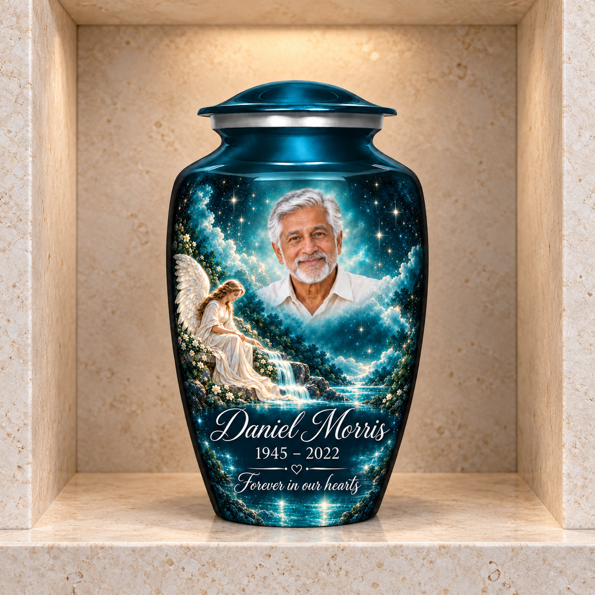 Blue adult angel urn with an angel beside a waterfall and starry sky displayed in a columbarium niche.