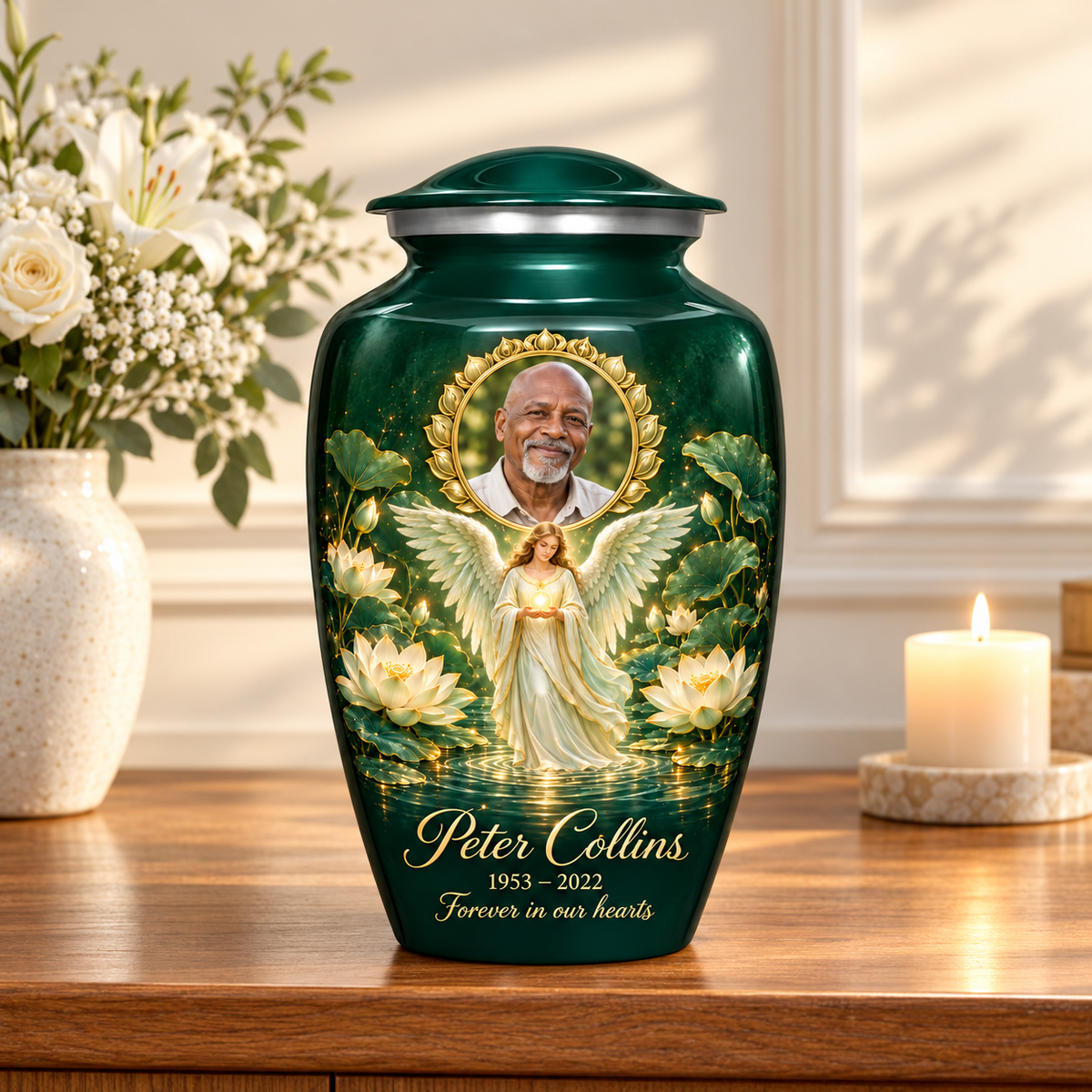 Green adult urn with an angel holding an orb above lotus water and a circular sample portrait frame, displayed on a memorial console.