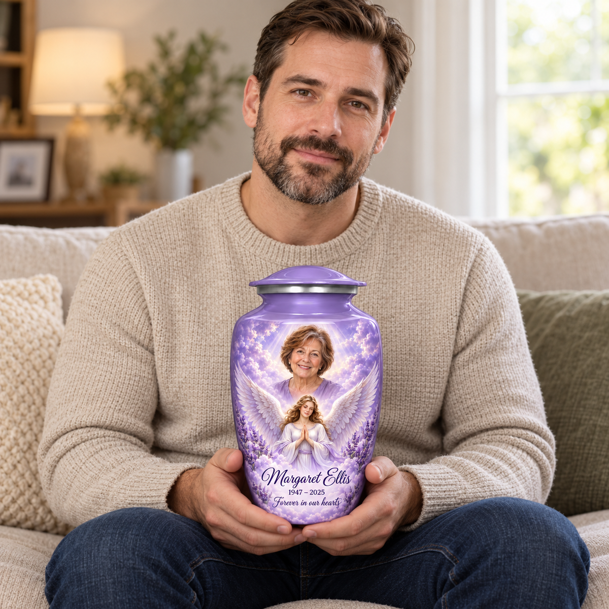 A seated person holding the purple angel urn with a praying angel, lavender flowers and clouds on their lap.